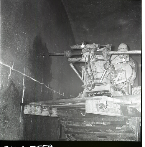 Machinery, crews drilling test cores in Zion-Mt. Carmel tunnel.