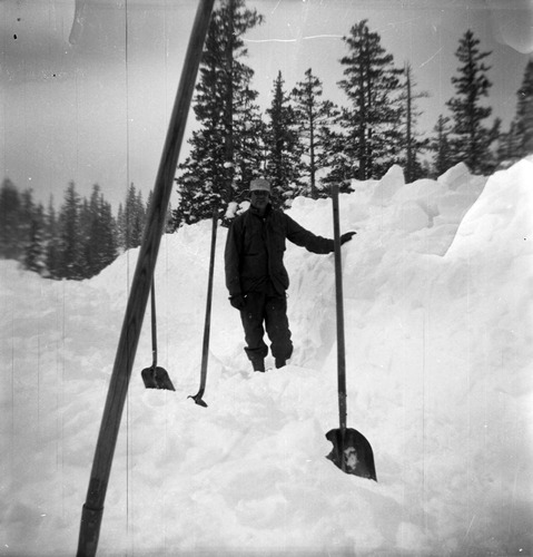 BW Photos showing rangers digging out the visitor center from snowdrift.