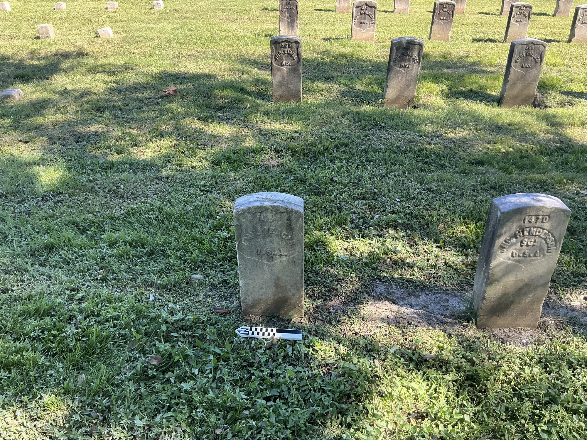 Extra image of historic upright marble headstone with recessed shield face.