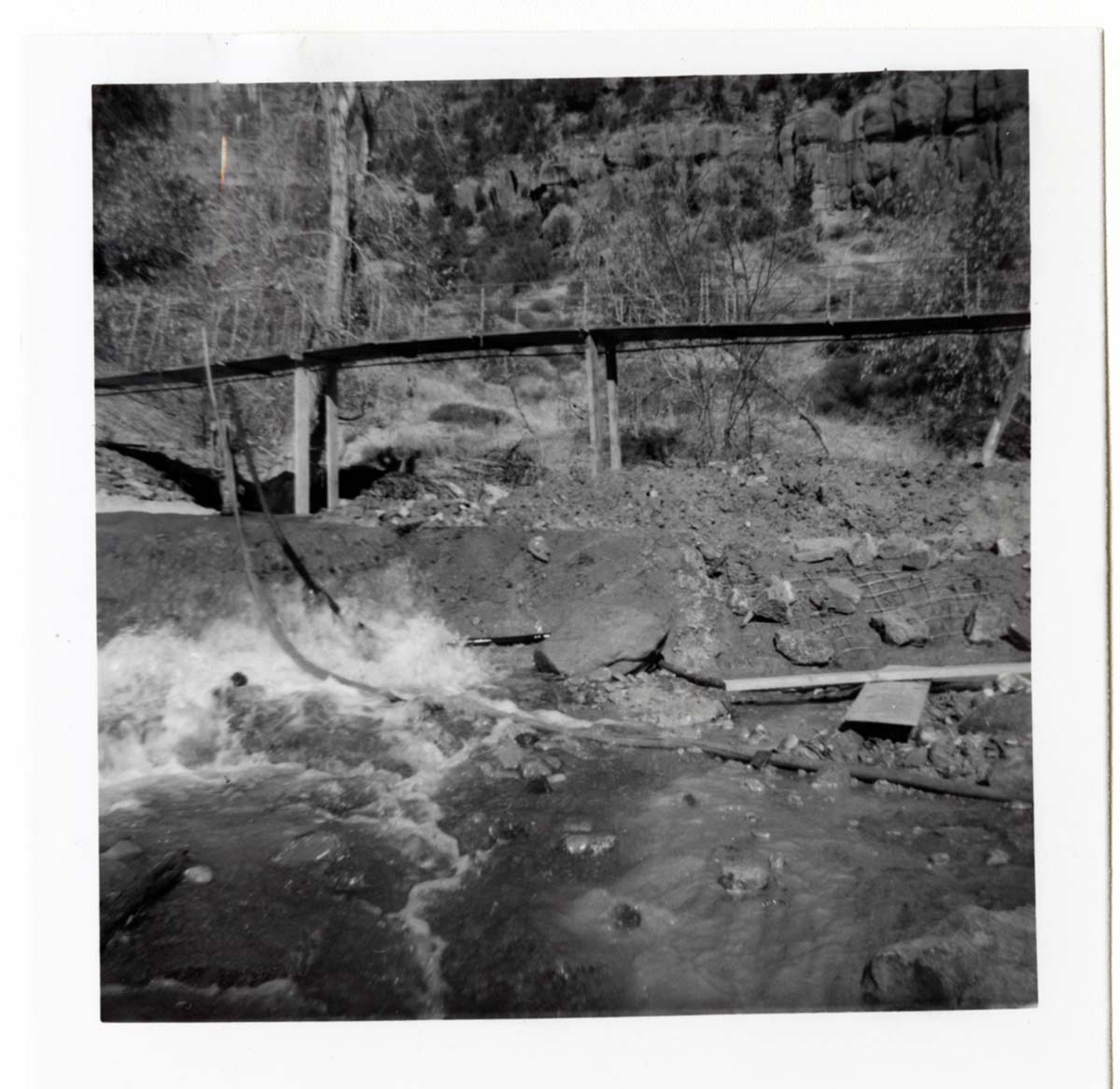 Protection/stabilization of the footings for the old Birch Creek suspension footbridge.