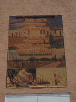 A banner on the side of a building.