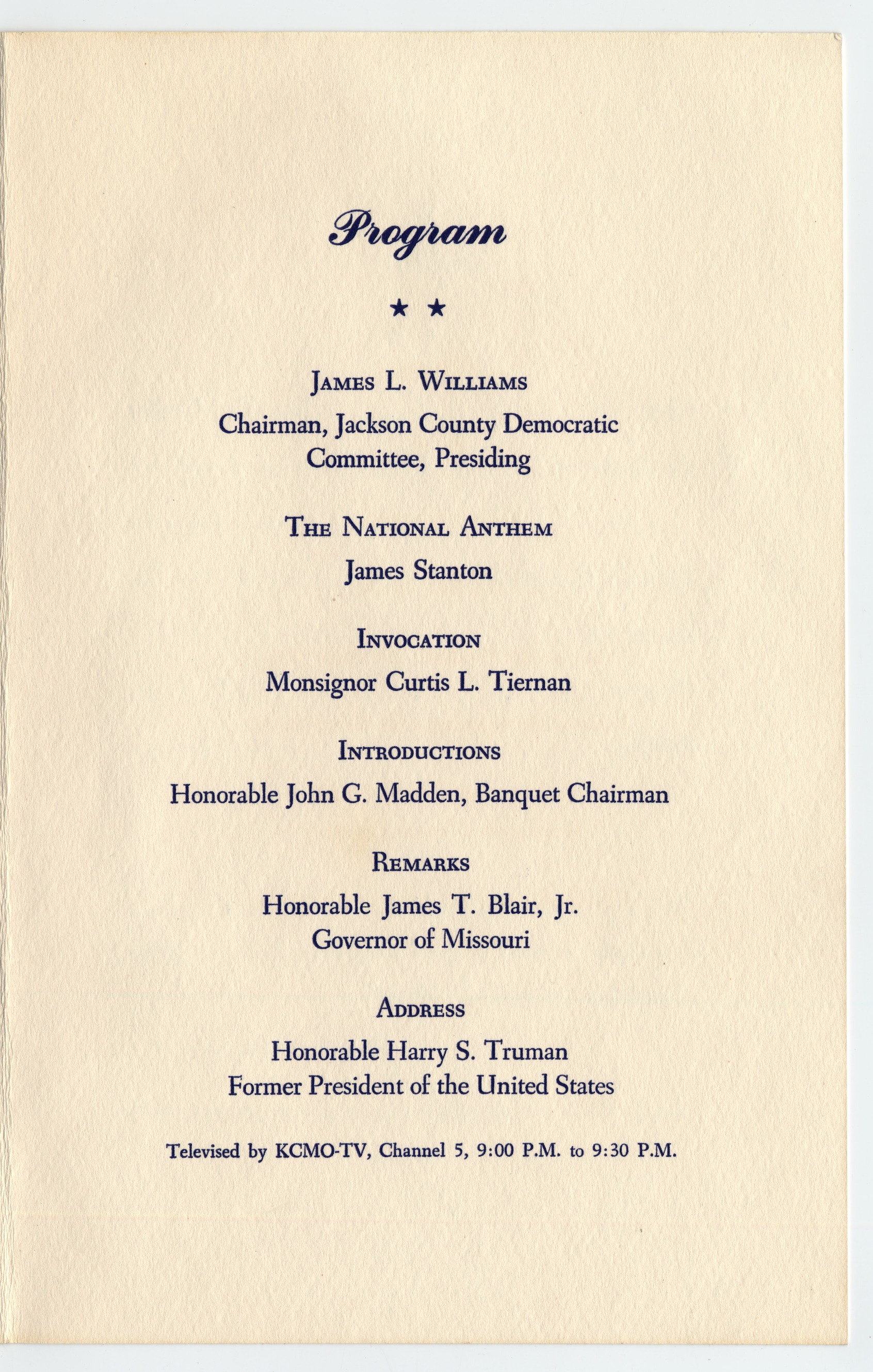 A program with a red torn edge and blue star border on cover. The program includes a menu and order of events for the night.