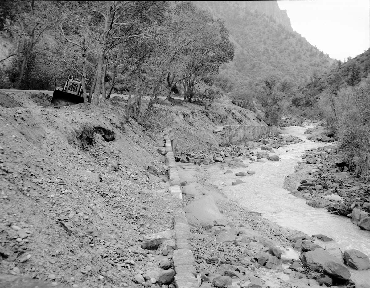 Flood damage to rock wall on Virgin River, a quarter mile south of Court of Patriarchs. Record of damage or defective workmanship.