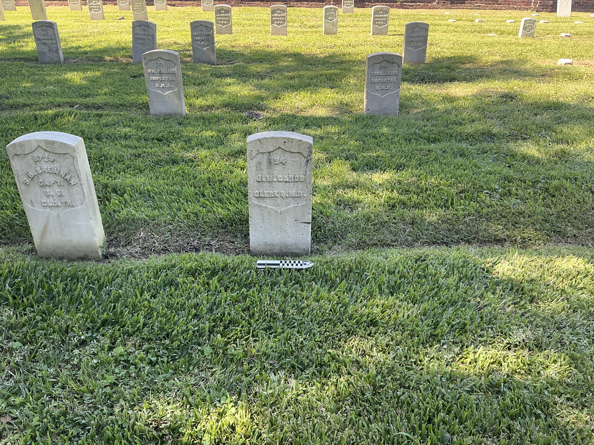 Extra image of historic upright marble headstone with recessed shield face.
