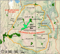 Map of physiographic provinces of the western United States. The Colorado Plateau is relatively undeformed area rough centered on the Four Corners area where Utah, Colorado, New Mexico, and Arizona come together. The map labels the high mountains of the Rocky Mountain province east of the Colorado Plateau, the parallel valleys and mountains of the Basin and Range province west and south of the Colorado Plateau. National parks adjacent to Glen Canyon National Recreation Area are Canyonlands National Park, Rainbow Bridge National Monument, Grand Canyon National Park, and Capitol Reef National Park. 