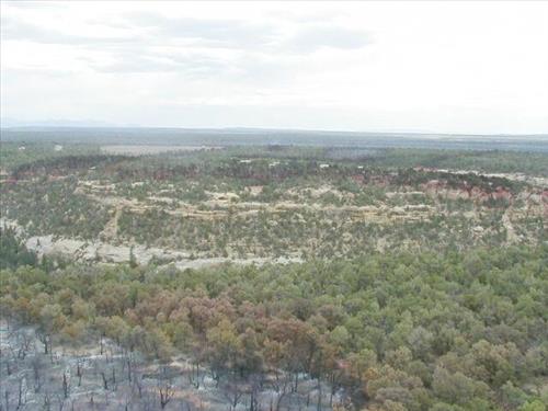Aerial views of Chapin Mesa area in and around buildings depicting burn areas in the aftermath of the Long Mesa Fire at Mesa Verde National Park, August 2002