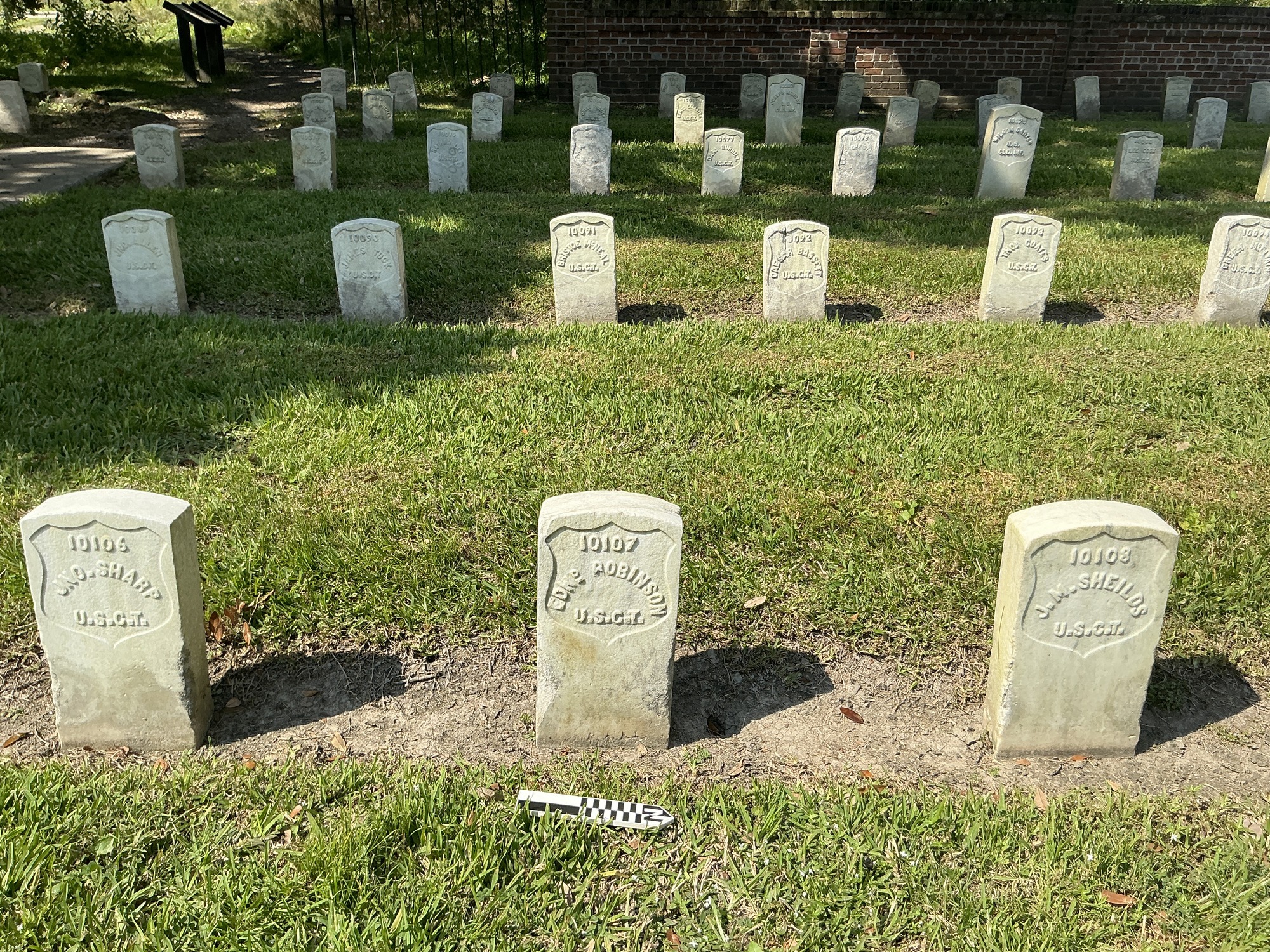 Extra image of historic upright marble headstone with recessed shield face.