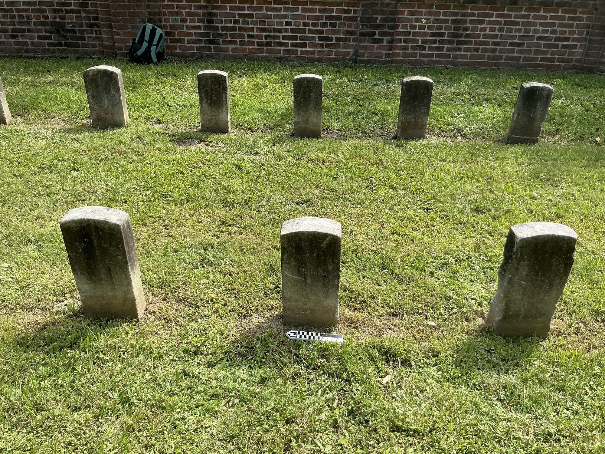 Extra image of historic upright marble headstone with recessed shield face.