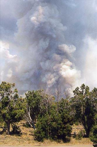 Intense burning with heavy gray and black smoke and flames during the Bircher fire, Mesa Verde National Park, July 2000