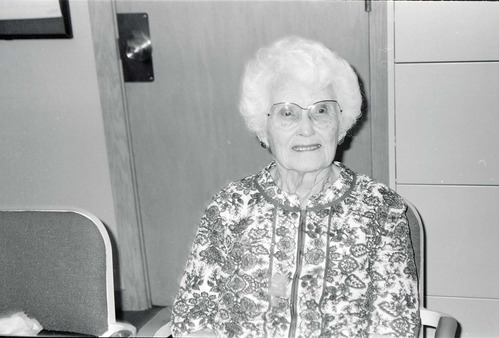 BW Photos of Superintendent Harold Grafe giving award to lady.