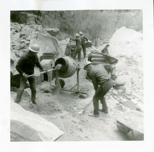 Workers operating construction machines during general trail maintenance on the Narrows.