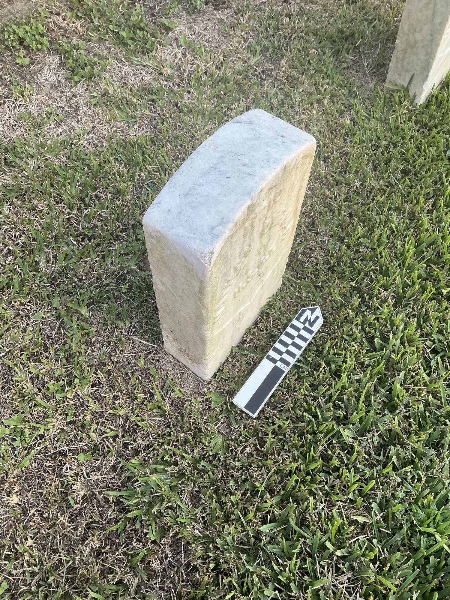 Extra image of historic upright marble headstone with recessed shield face.