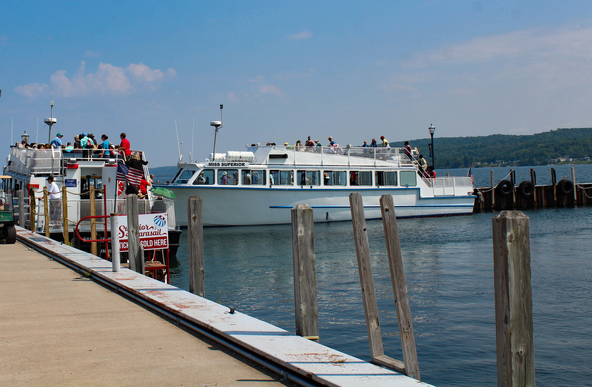 Two passenger boats on a dock