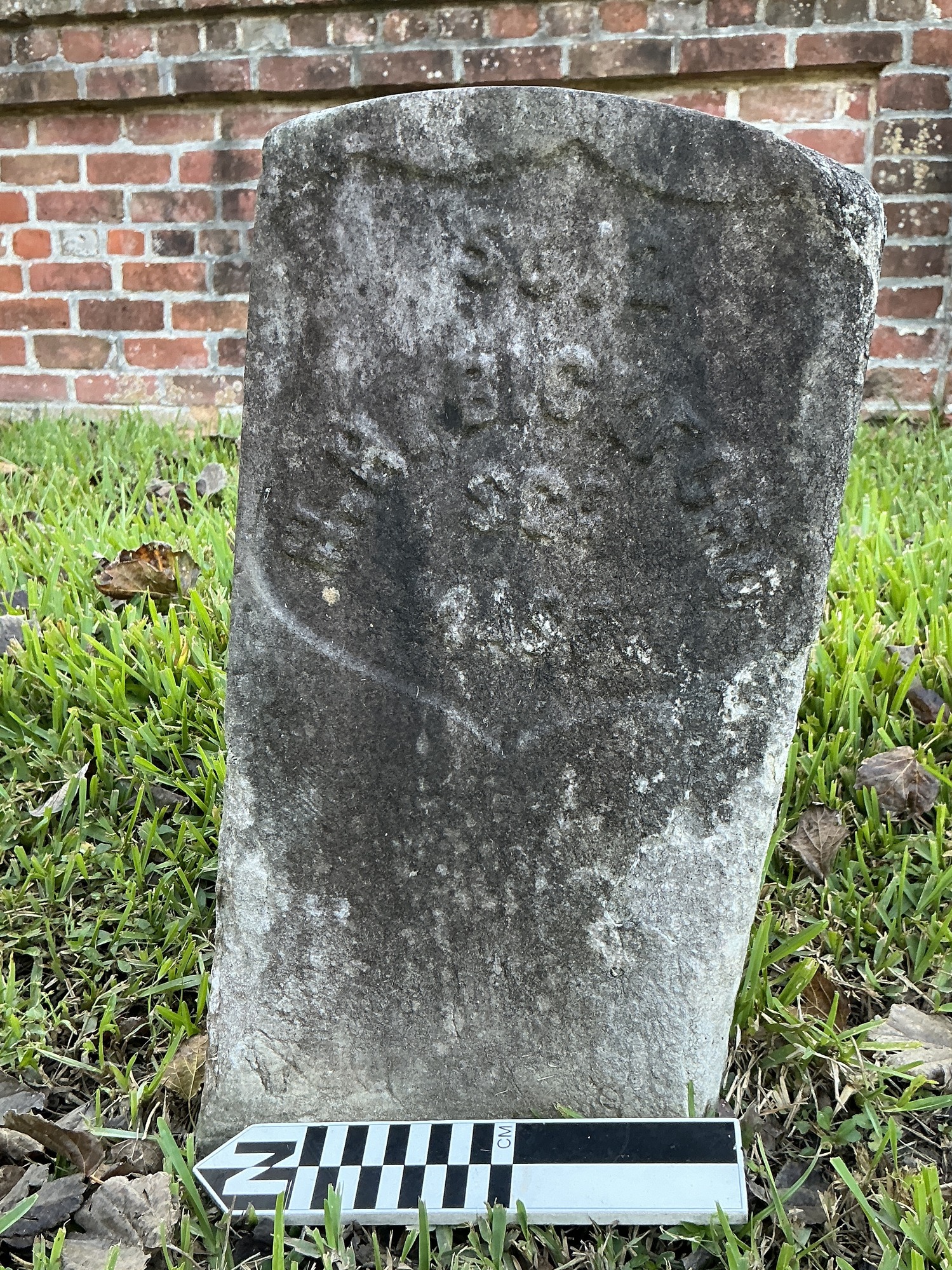 Extra image of historic upright marble headstone with recessed shield face.