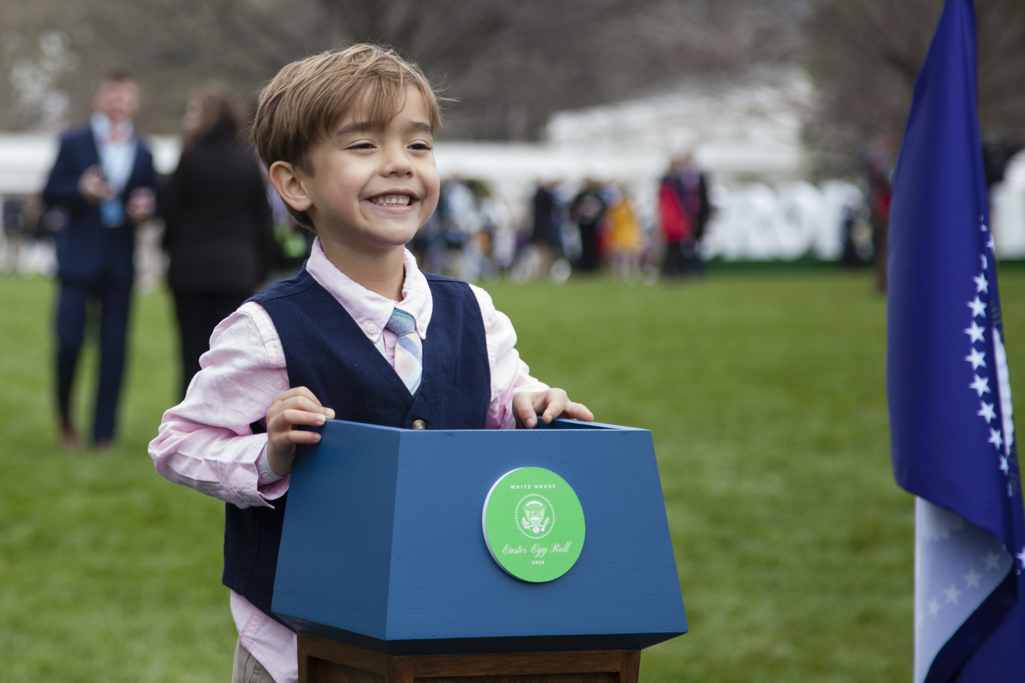 A young boy poses as the future President of the United States in front of the White House. 