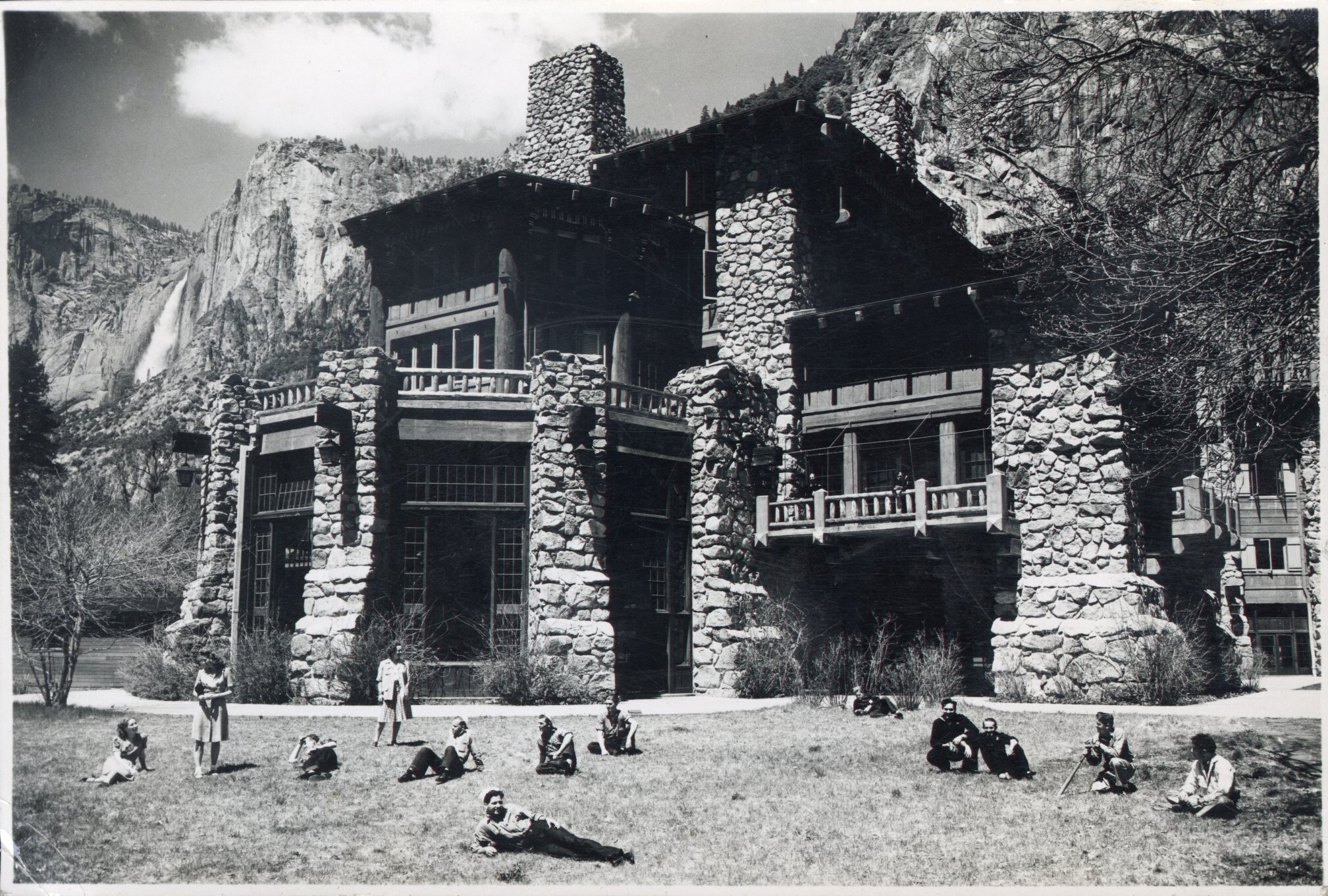 Navymen and nurses lounging on the lawn outside of the Ahwahnee