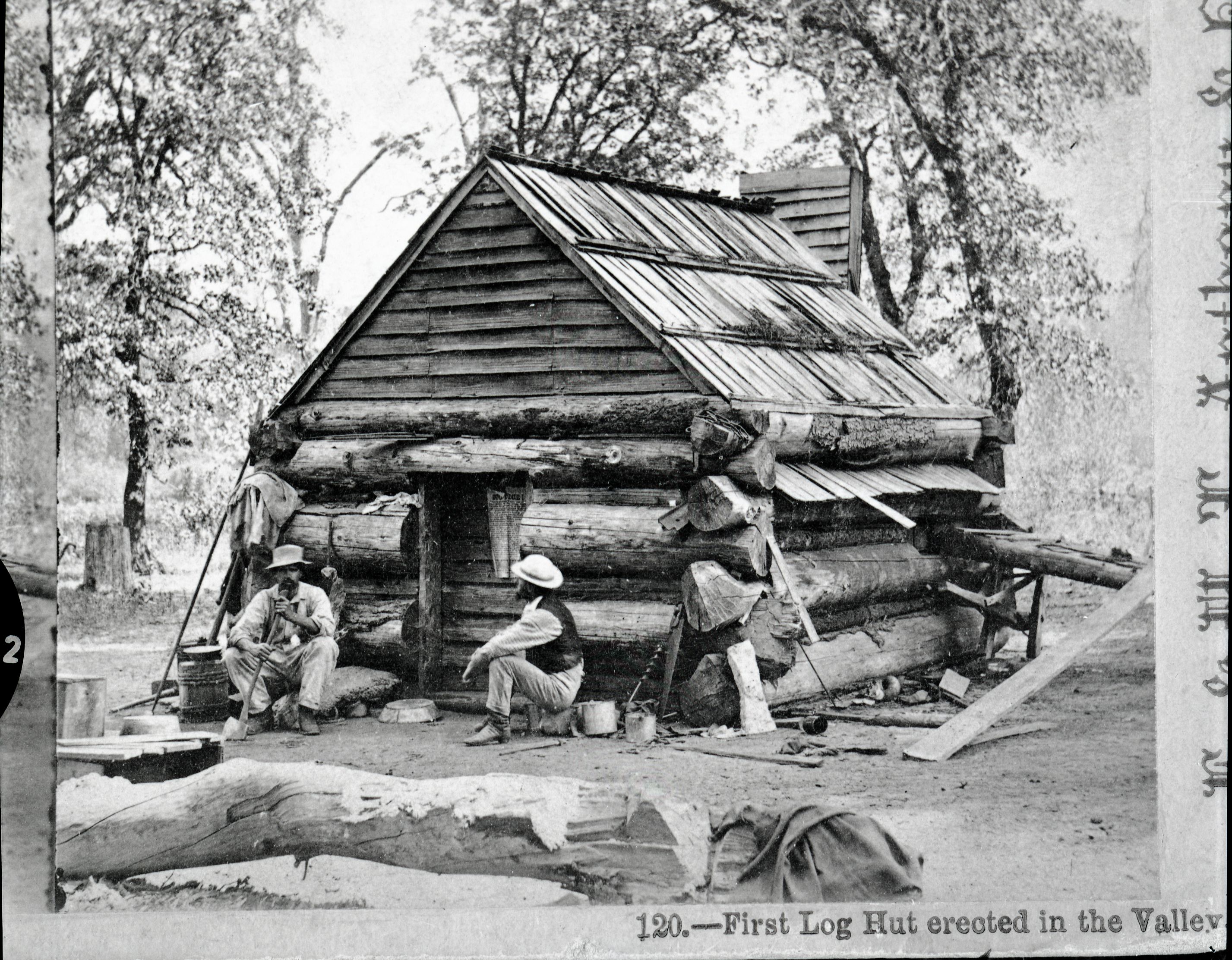 Copy Neg: July 1985 by Michael Dixon. Detail of L. Smaus stereo (RL-16,500). Captioned: "Lamon's log cabin, the first erected in the valley."