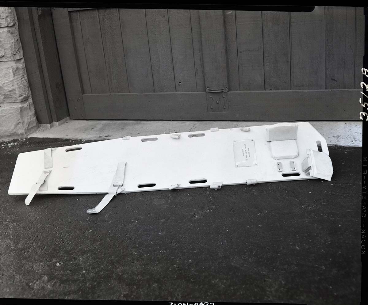 Special stretcher for first-aid in neck injuries designed by Rudy Lueck.
