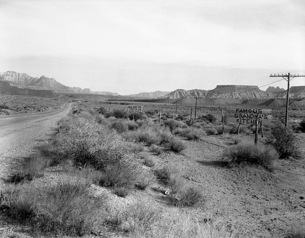 The Grandma's signs on Utah State Route 15 (now State Route 9), the black on yellow signs were at almost every turn from below Virgin, Utah to Zion National Park. These photos were taken as documentation to the proposed clean up project to remove undesirable signs and debris on the route to Zion. This is a view from west of the town of Virgin, Utah looking north, West Temple in the distance (left) and Rockville Mountain (right).