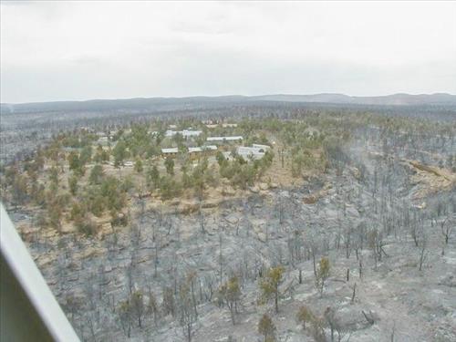 Aerial views of Chapin Mesa area in and around buildings depicting burn areas in the aftermath of the Long Mesa Fire at Mesa Verde National Park, August 2002