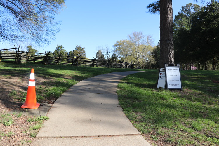 Concrete path with incline. grass on either side
