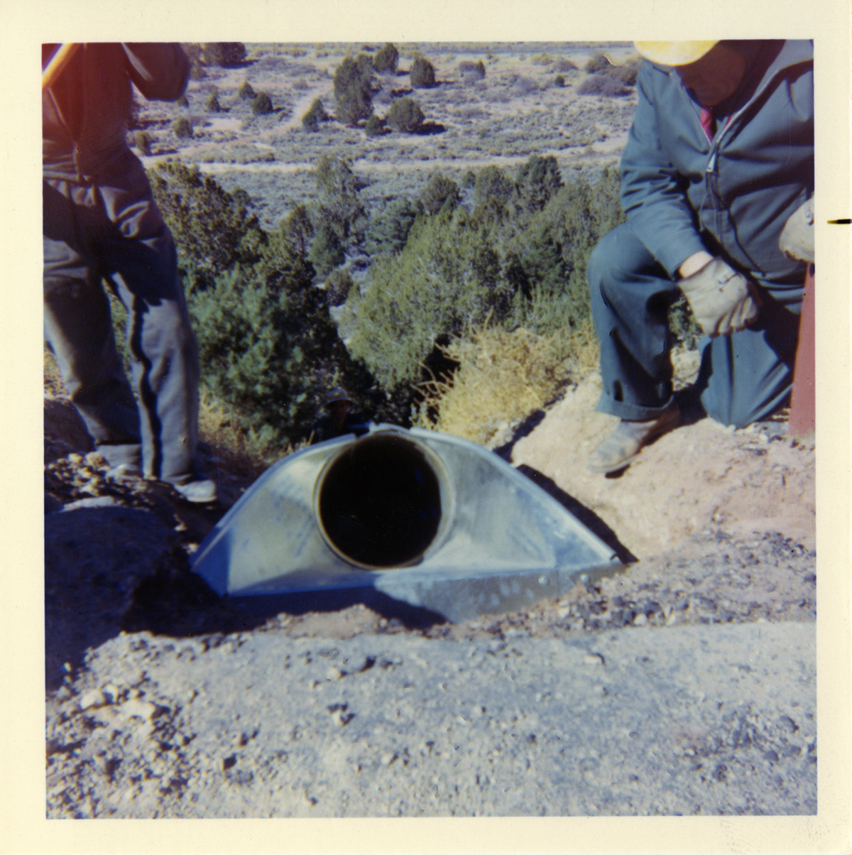 Men working to install a drain piper along the Kolob Canyon Road.