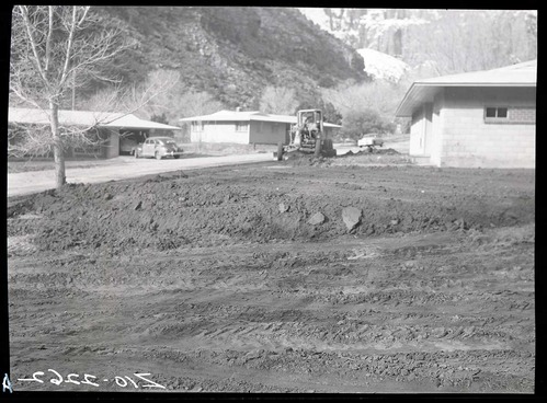 Grading around residence Building 6 in preparation for planting.