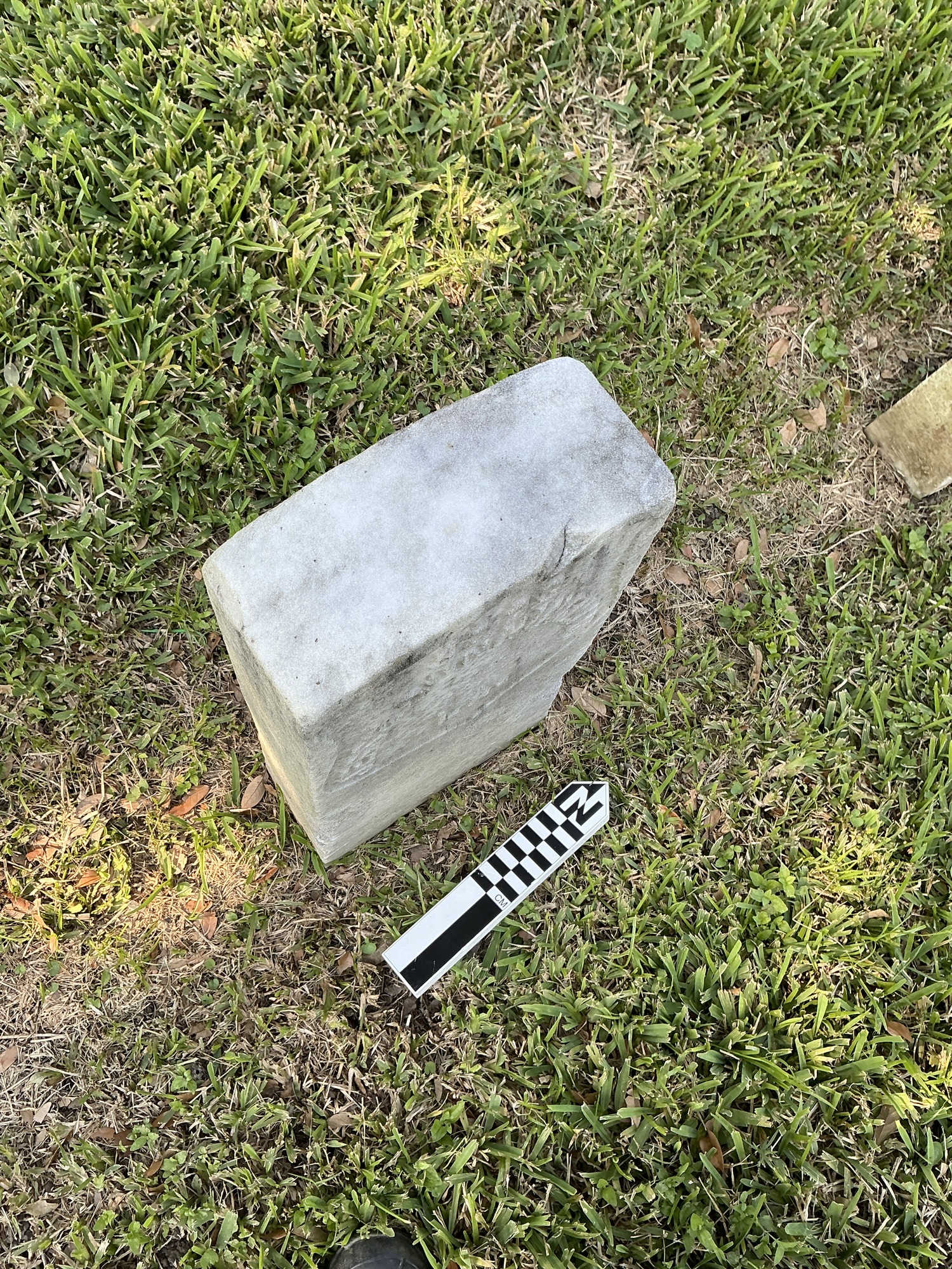 Extra image of historic upright marble headstone with recessed shield face.