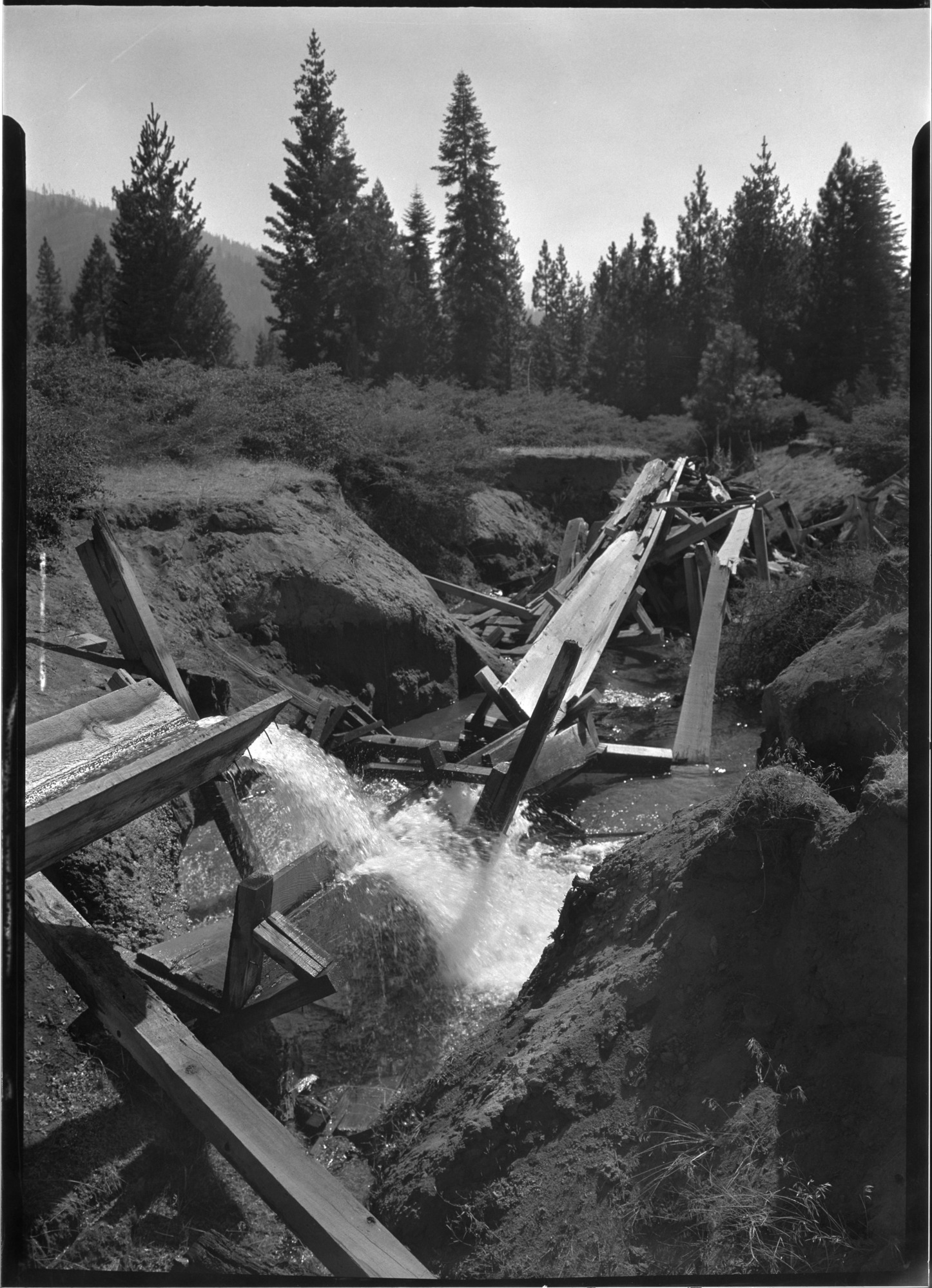 Sugar Pine Lumber Co. flume where it spills into open ditch to flow to the mill.