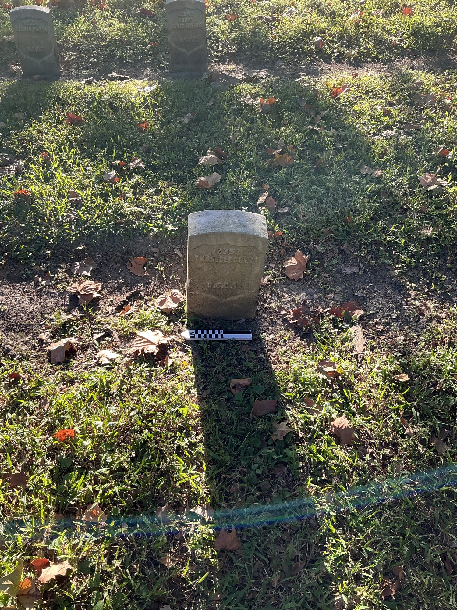 Extra image of historic upright marble headstone with recessed shield face.