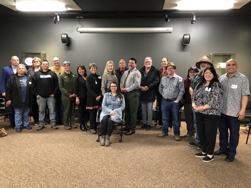 A photo of men and women gathered together in the Fort Vancouver Visitor Center.