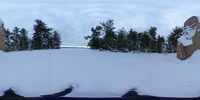 Spherical image of a granite monolith on a plaza covered in snow with Washington Monument in the distance across a river