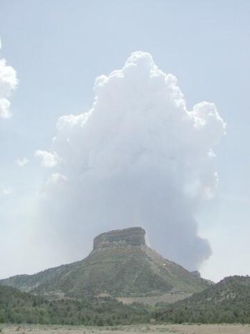 News media and park staff observe fire from a parking lot as a white smoke plume rises vertically over Long Mesa, Long Mesa Fire, Mesa Verde National Park, July-August 2002