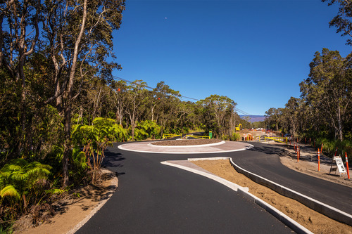 Freshly paved traffic lanes and a newly constructed traffic roundabout 