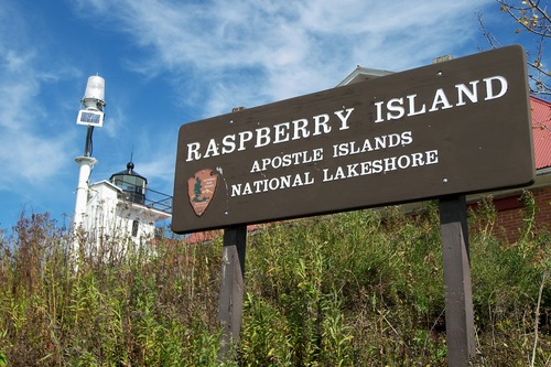This sign, identifying Raspberry Island, is visible from the dock and the water.