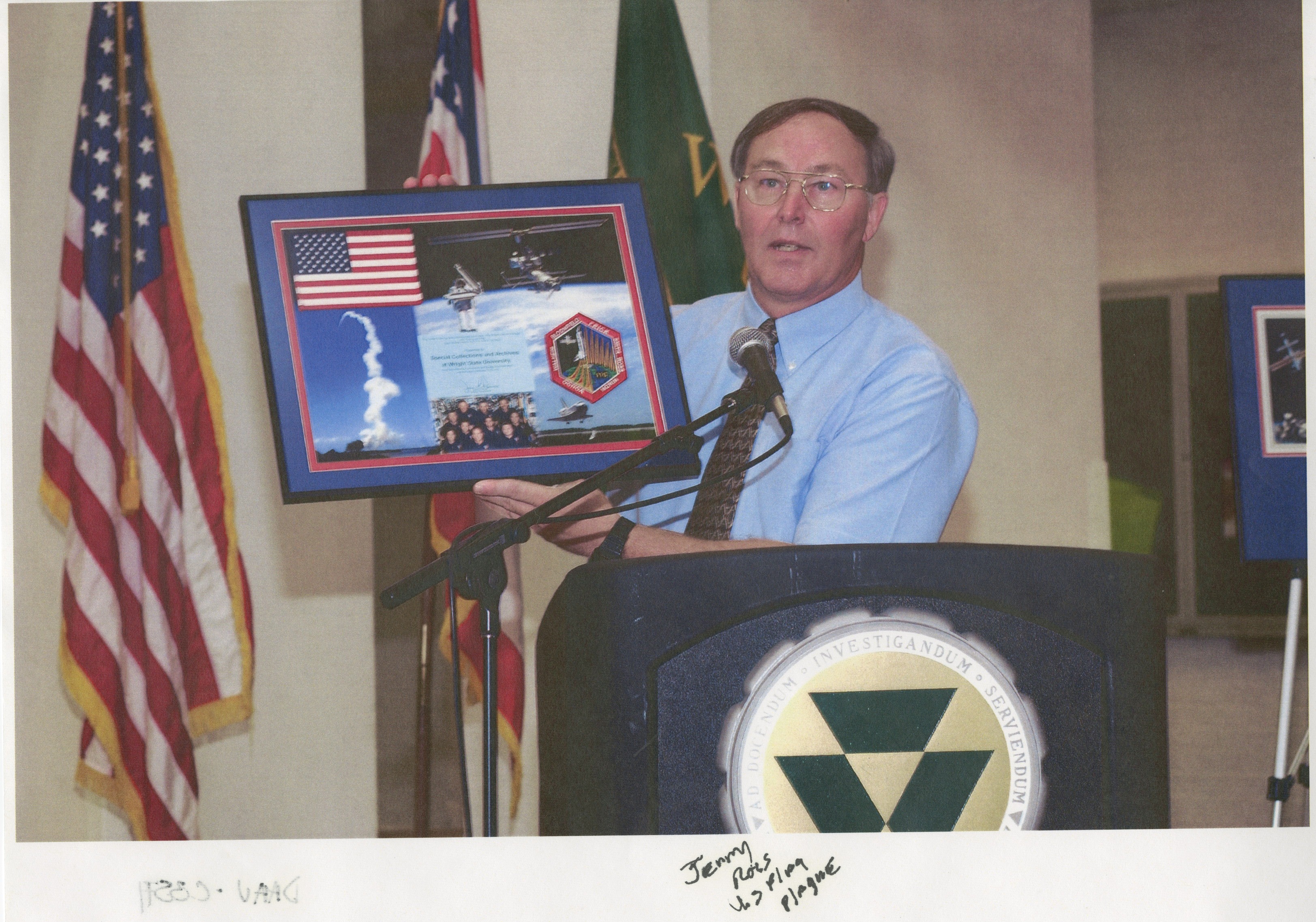 A man holding a plaque