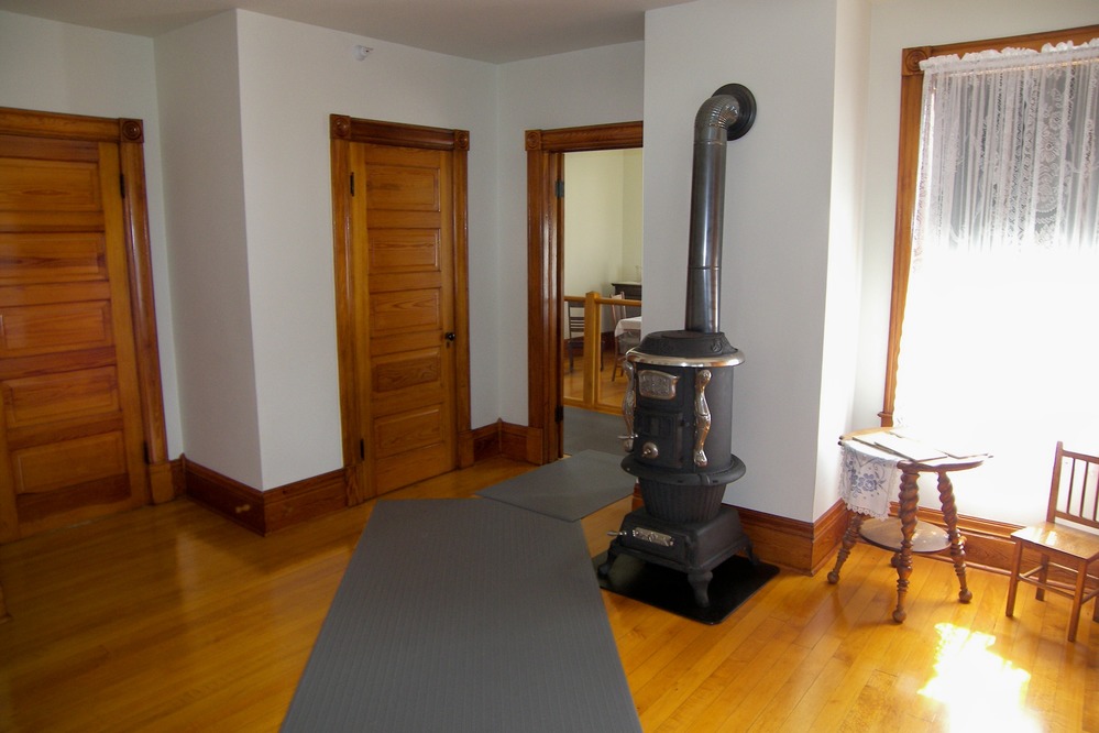 Wood stoves helped heat the living room and the dining room.