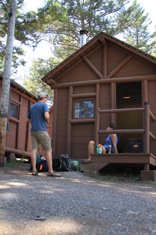 Roosevelt Lodge, visitors in front of a cabin