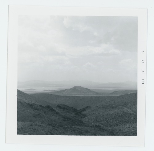 Black and white image of Pinto Backcountry Camp. Northern portion of jeep trail from Mission Well to Old Swede Mine and nearby Pinto Basin camp. Looking South into Pinto Basin.