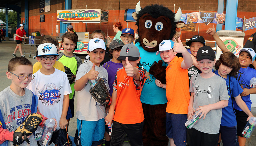Kids pose with mascot at Renegades Baseball NPS Night. 