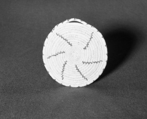 Marie Rozier Collection, Catalog No. 232. Object: Papago hot pad. Dimensions: 7". Materials: yucca, devil's claw. Technology: ---. Collection History: Purchased at San Xavier del Bac in 1973 for $6. Photographed by Michael Dixon, Dec. 1982. Catalogued by Craig Bates and Barbara Beroza. Yosemite Collections, National Park Service.