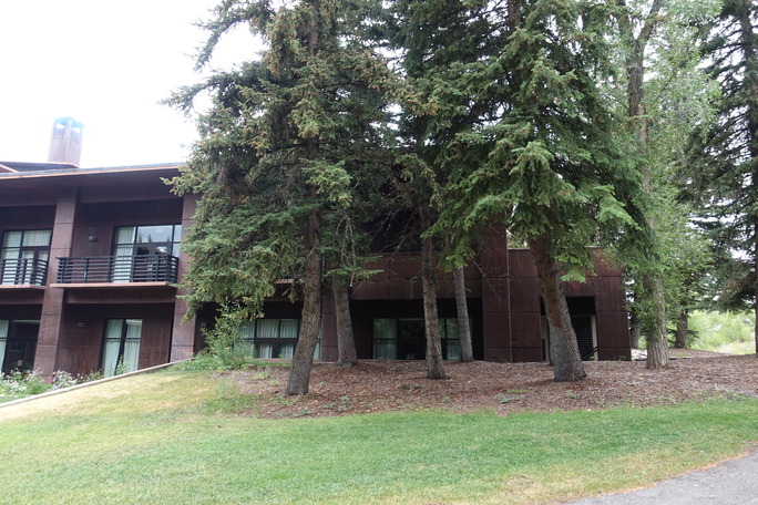The brown concrete exterior of the lodge, front of the building.
