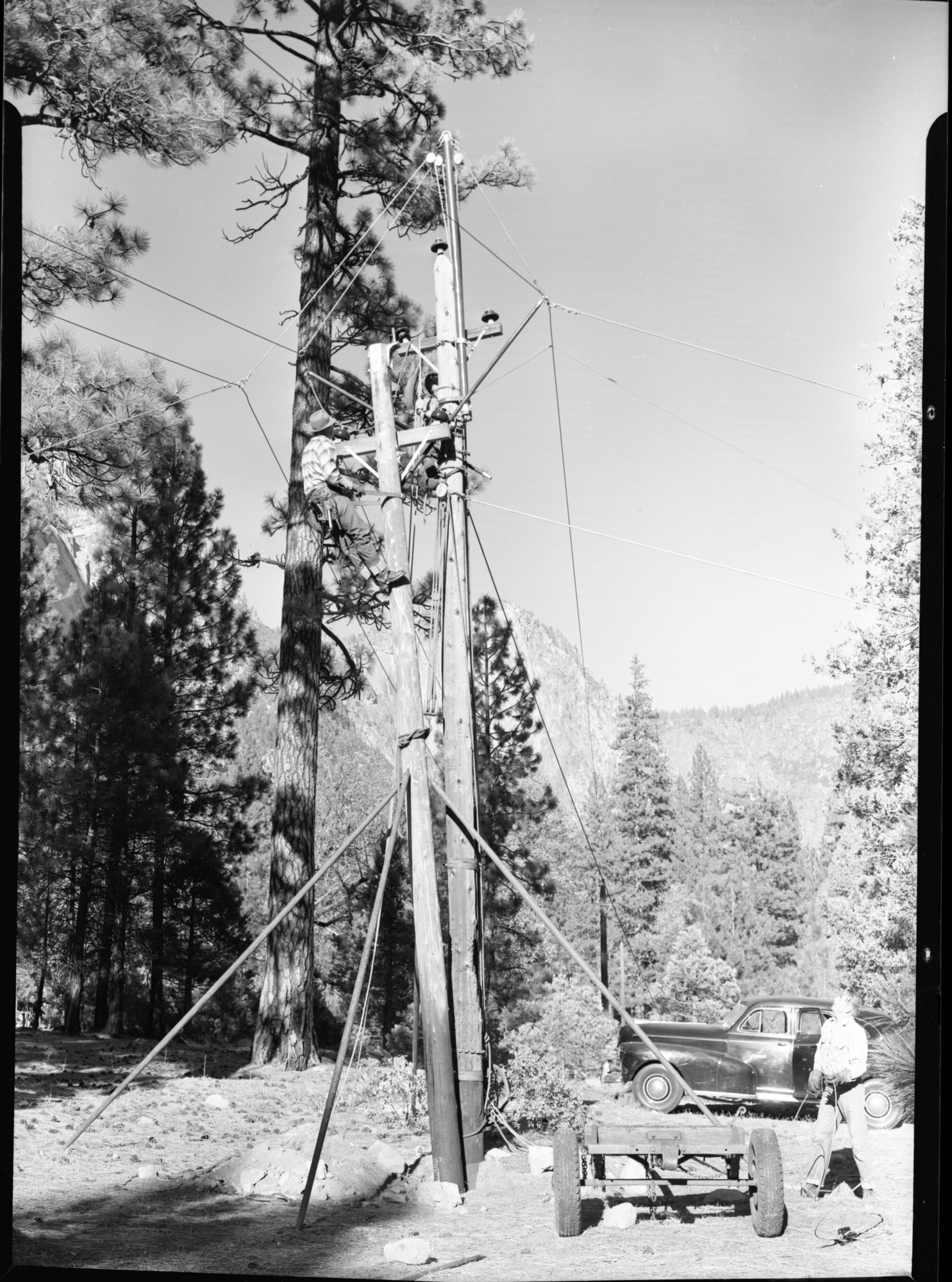 P.G. & E. Crew Transferring Hot Power Lines to Another Pole