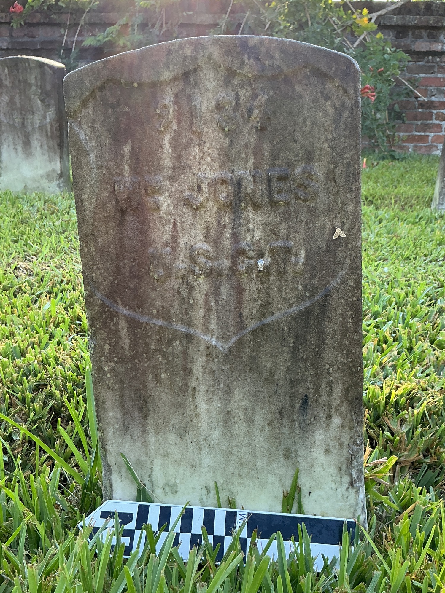 Extra image of historic upright marble headstone with recessed shield face.