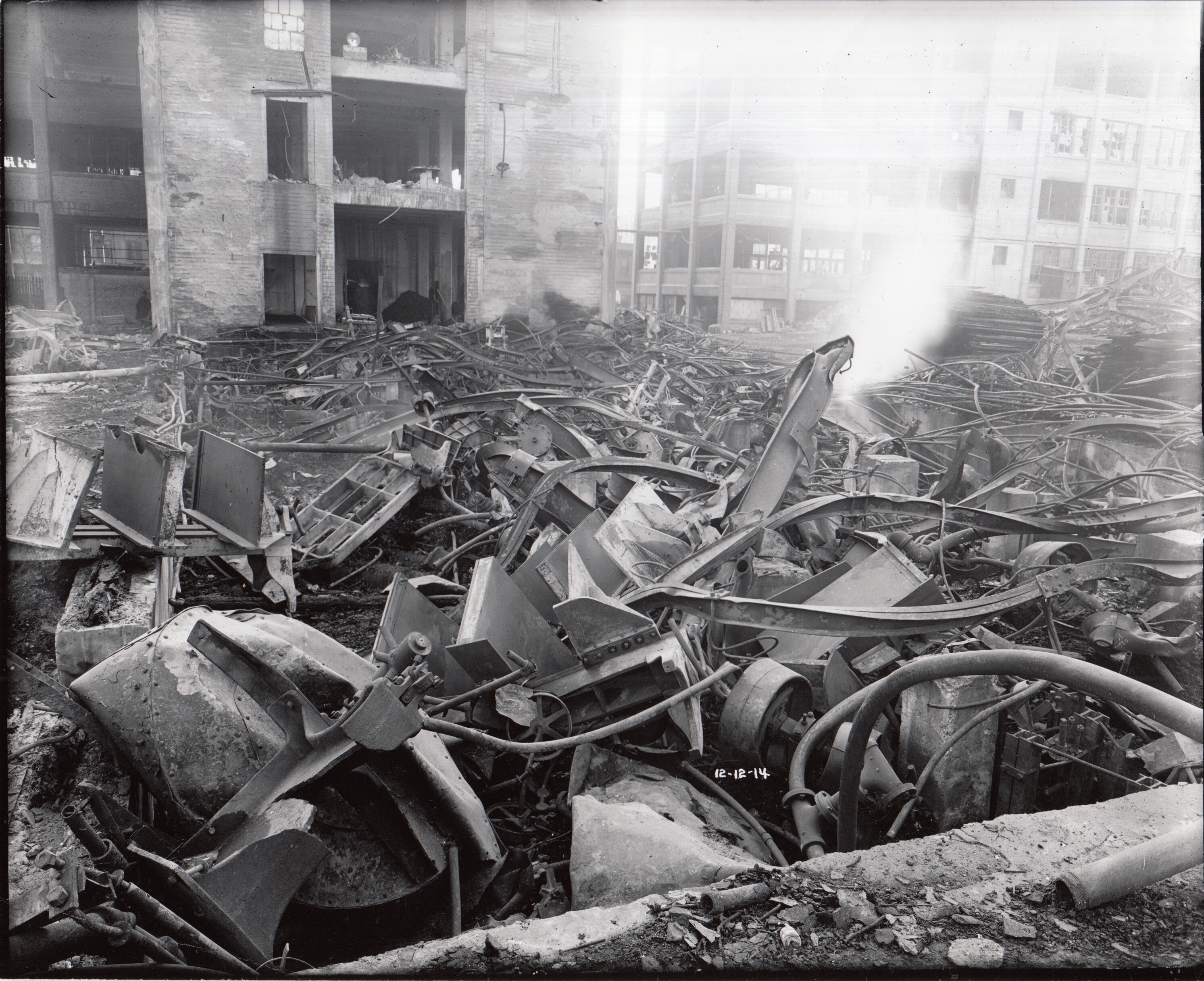 Remains of Building 18 with twisted metal in foreground.