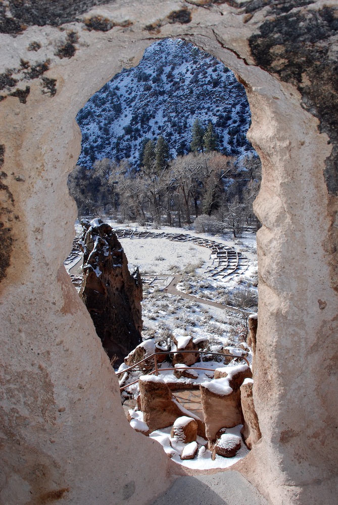A view of a snowy Tyuonyi from a cavate on the Main Loop Trail