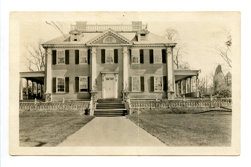 Black and white photograph of Georgian mansion.