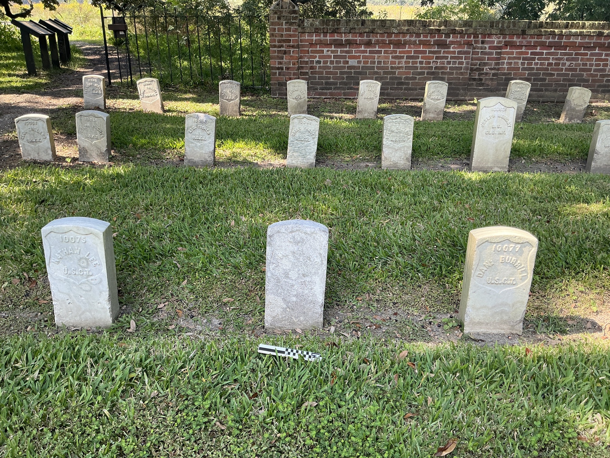 Extra image of historic upright marble headstone with recessed shield face.
