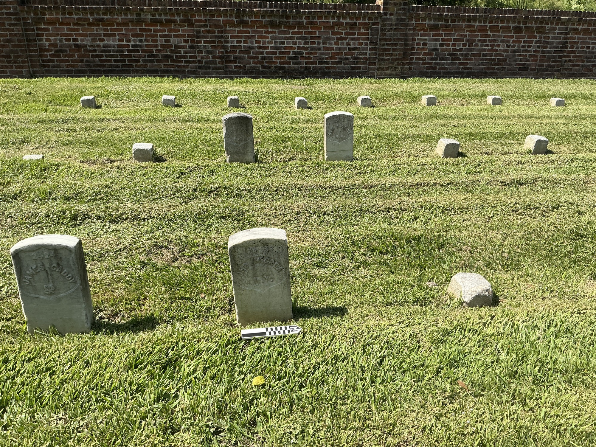 Extra image of historic upright marble headstone with recessed shield face.