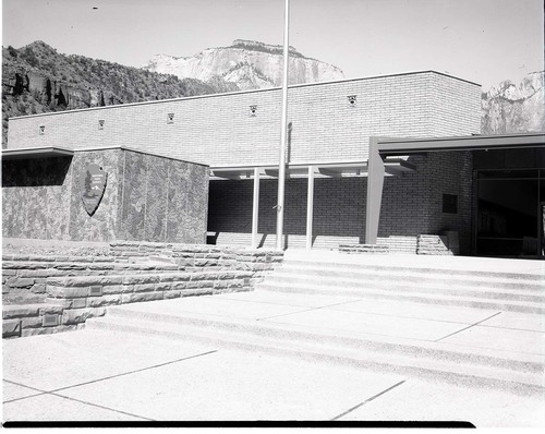 Mission 66 Visitor Center and Museum with detail around NPS emblem - east elevation visitor center construction.